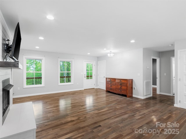 155 Pebble Ridge Rd, Spruce Pine, NC 28777 - unfurnished living room with a fireplace, healthy amount of natural light, wood finished floors, and recessed lighting