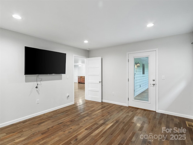 155 Pebble Ridge Rd, Spruce Pine, NC 28777 - unfurnished living room with wood finished floors, baseboards, and recessed lighting