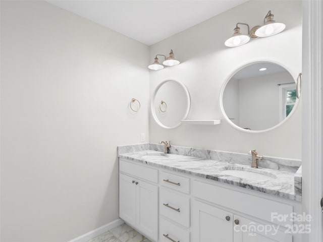 155 Pebble Ridge Rd, Spruce Pine, NC 28777 - full bathroom with double vanity, marble look tiles, and baseboards