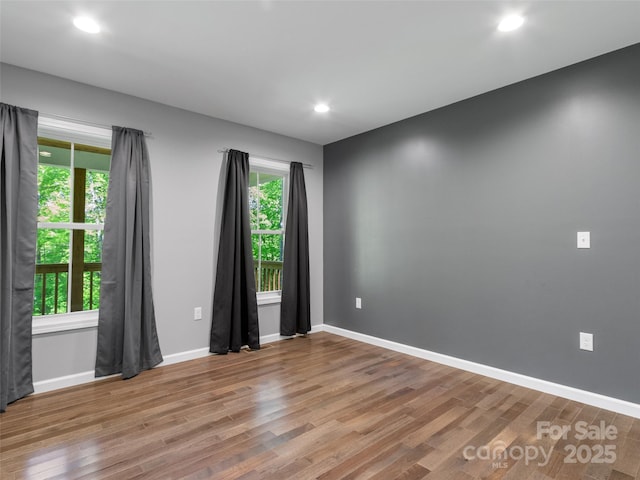 155 Pebble Ridge Rd, Spruce Pine, NC 28777 - empty room featuring wood finished floors, healthy amount of natural light, baseboards, and recessed lighting