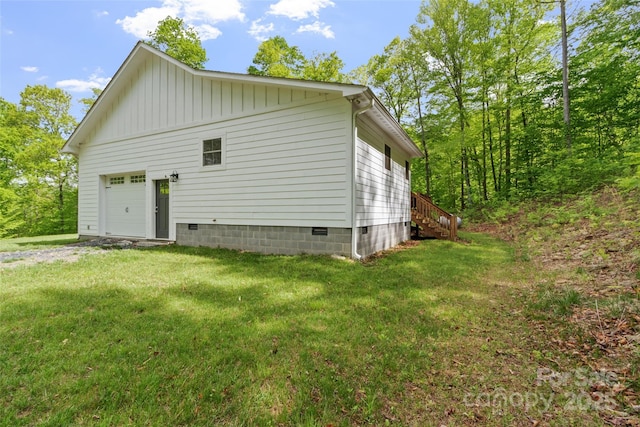 155 Pebble Ridge Rd, Spruce Pine, NC 28777 - view of property exterior featuring a garage, a yard, crawl space, driveway, and board and batten siding
