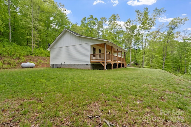 155 Pebble Ridge Rd, Spruce Pine, NC 28777 - view of side of home featuring a lawn, crawl space, central air condition unit, and a wooded view