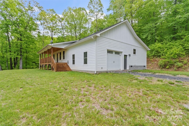 155 Pebble Ridge Rd, Spruce Pine, NC 28777 - view of property exterior featuring board and batten siding, a lawn, a wooden deck, a garage, and stairway