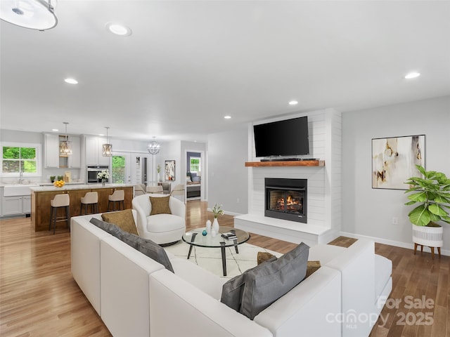155 Pebble Ridge Rd, Spruce Pine, NC 28777 - living room with a fireplace, light wood finished floors, recessed lighting, and baseboards