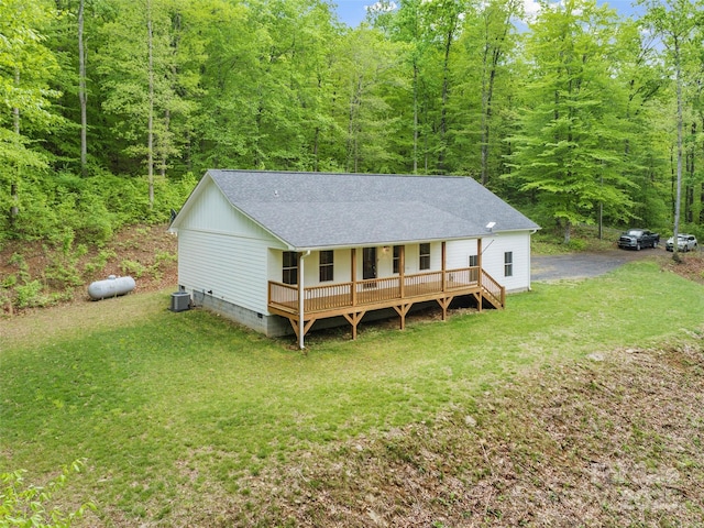 155 Pebble Ridge Rd, Spruce Pine, NC 28777 - rear view of house with a shingled roof, a wooded view, cooling unit, and a lawn