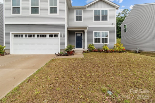 traditional home with an attached garage, a front lawn, and driveway