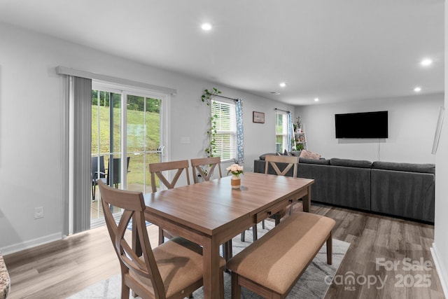 dining room featuring light wood-style floors, recessed lighting, and baseboards