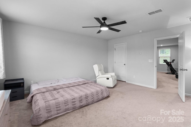 bedroom with light colored carpet, baseboards, and ceiling fan