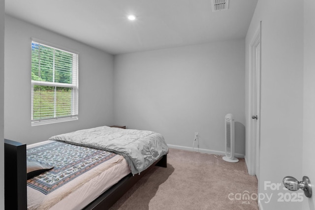 carpeted bedroom with baseboards