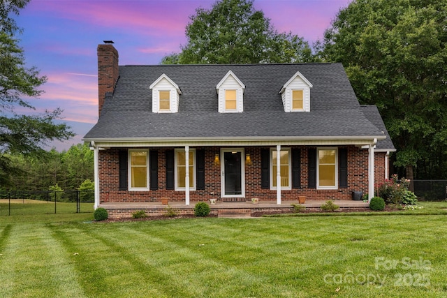 3049 Stablegate Dr, Gastonia, NC 28052 - cape cod home featuring a chimney, brick siding, covered porch, and a shingled roof