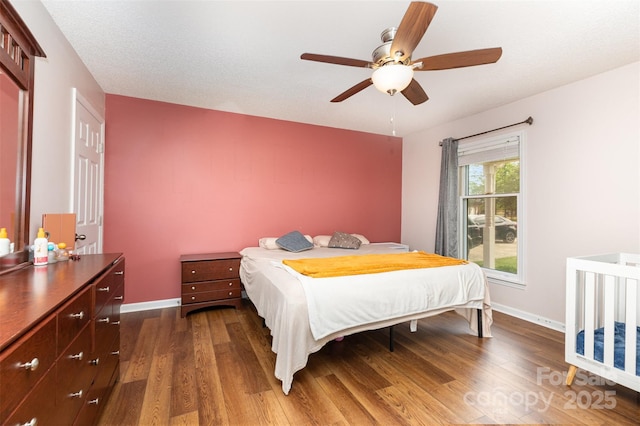 3049 Stablegate Dr, Gastonia, NC 28052 - bedroom with dark wood-style flooring, baseboards, and ceiling fan