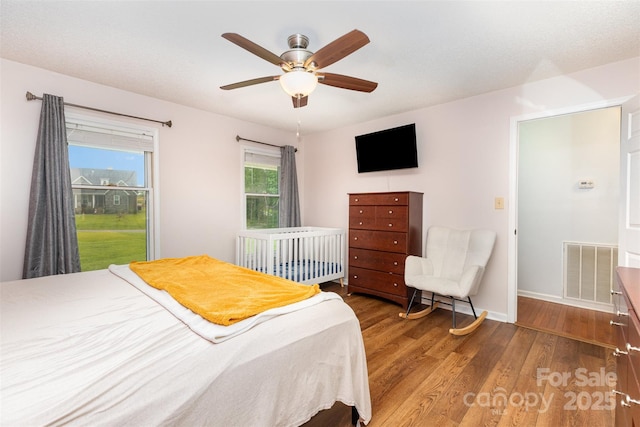 3049 Stablegate Dr, Gastonia, NC 28052 - bedroom with wood finished floors, baseboards, and a ceiling fan