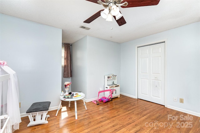 3049 Stablegate Dr, Gastonia, NC 28052 - recreation room featuring light wood-style floors, ceiling fan, and baseboards