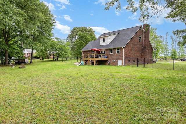 3049 Stablegate Dr, Gastonia, NC 28052 - back of house featuring a deck, a chimney, an attached garage, and brick siding