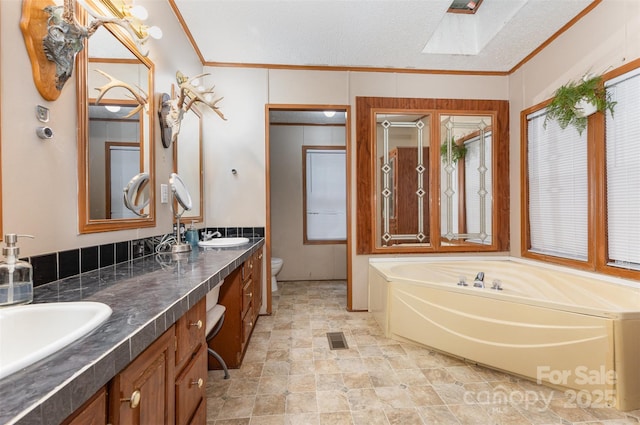 403 Carpenter Parker Ln, Rock Hill, SC 29730 - full bath featuring a skylight, ornamental molding, a bath, double vanity, and toilet