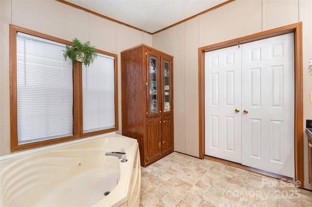 403 Carpenter Parker Ln, Rock Hill, SC 29730 - bathroom with crown molding, a jetted tub, and a textured ceiling