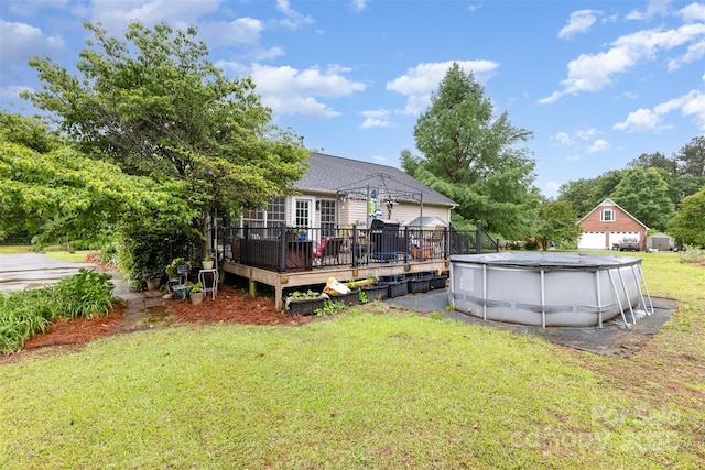 2906 Chapman Cir, Rock Hill, SC 29732 - back of house featuring a deck, a lawn, and a covered pool