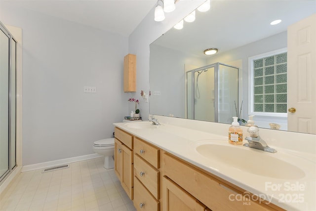 2906 Chapman Cir, Rock Hill, SC 29732 - bathroom featuring a shower stall, double vanity, baseboards, and toilet