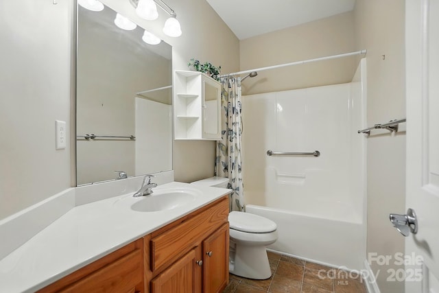 bathroom featuring toilet, vanity, shower / bath combo, and stone finish floors