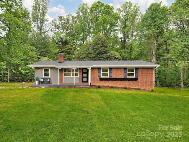 16 Emerson Poore Dr, Candler, NC 28715 - single story home with a chimney, a front lawn, brick siding, and board and batten siding