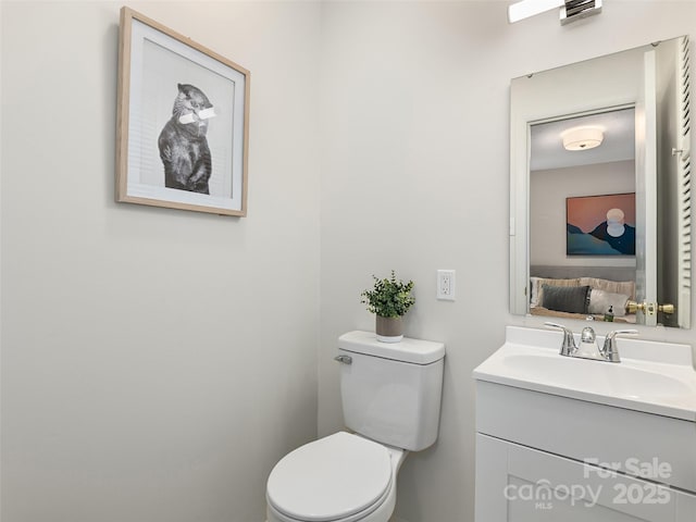 16 Emerson Poore Dr, Candler, NC 28715 - half bathroom featuring vanity and toilet