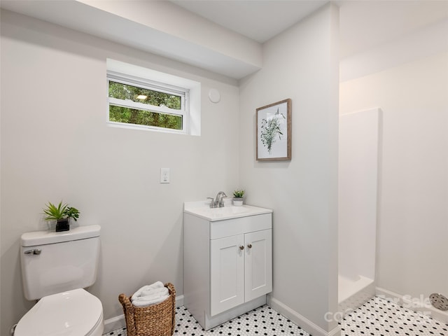 16 Emerson Poore Dr, Candler, NC 28715 - full bathroom featuring toilet, a shower stall, baseboards, and vanity