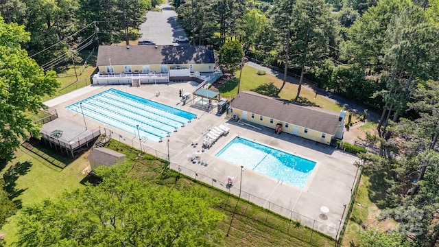 aerial view of property and surrounding area with a pool