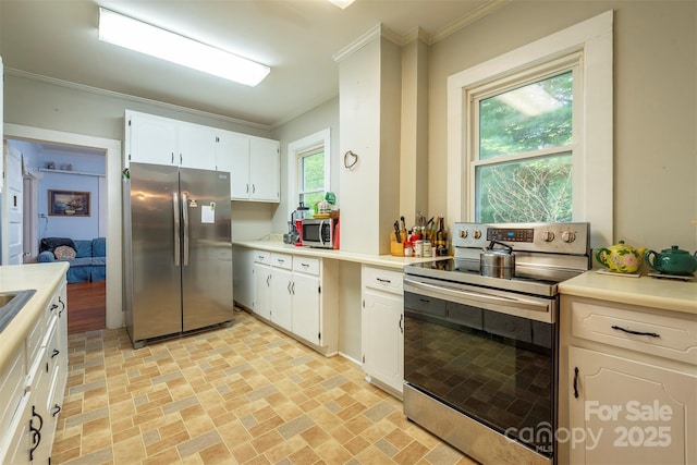 223 Assembly Dr, Montreat, NC 28757 - kitchen featuring stainless steel appliances, brick patterned flooring, crown molding, light countertops, and white cabinetry