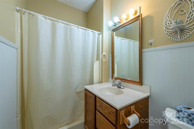 223 Assembly Dr, Montreat, NC 28757 - full bath with toilet, a shower with shower curtain, vanity, and a wainscoted wall