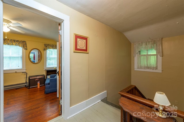 223 Assembly Dr, Montreat, NC 28757 - hall featuring a baseboard heating unit, wood finished floors, and lofted ceiling