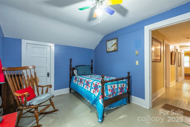 223 Assembly Dr, Montreat, NC 28757 - bedroom featuring wood finished floors, baseboards, vaulted ceiling, and a ceiling fan