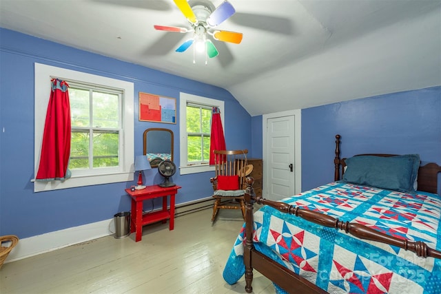 223 Assembly Dr, Montreat, NC 28757 - bedroom with lofted ceiling, wood finished floors, baseboard heating, ceiling fan, and baseboards