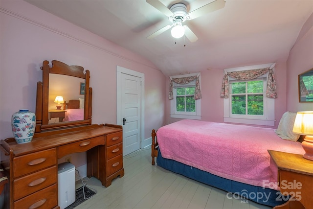 223 Assembly Dr, Montreat, NC 28757 - bedroom with lofted ceiling, light wood-type flooring, and a ceiling fan
