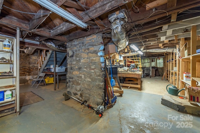 223 Assembly Dr, Montreat, NC 28757 - unfinished basement with a workshop area and stairs