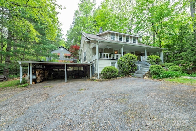 223 Assembly Dr, Montreat, NC 28757 - view of front of house with a chimney, covered porch, driveway, stairway, and a carport