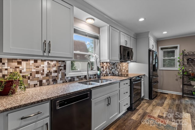 147 Bluewing Ln Unit 274, Mooresville, NC 28117 - kitchen featuring black appliances, a sink, stone counters, backsplash, and dark wood finished floors