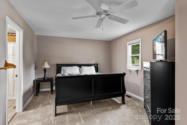 147 Bluewing Ln Unit 274, Mooresville, NC 28117 - bedroom with baseboards, light colored carpet, a ceiling fan, and connected bathroom
