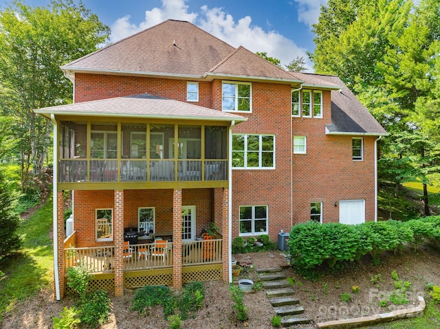 357 Lentz Landing Ln, Nebo, NC 28761 - back of property featuring a sunroom, brick siding, a deck, and a shingled roof
