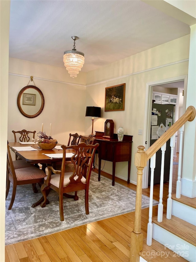 357 Lentz Landing Ln, Nebo, NC 28761 - dining room featuring hardwood / wood-style flooring, stairway, and a chandelier