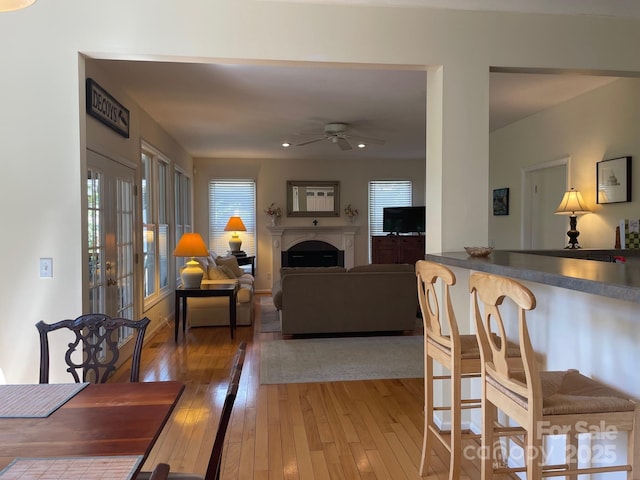 357 Lentz Landing Ln, Nebo, NC 28761 - dining space with ceiling fan, light wood-style flooring, a fireplace, and recessed lighting
