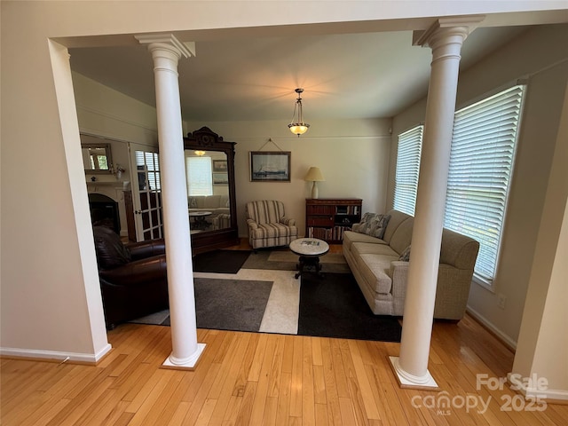 357 Lentz Landing Ln, Nebo, NC 28761 - living area with decorative columns, healthy amount of natural light, and light wood-type flooring