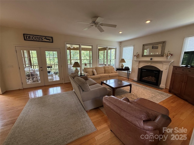 357 Lentz Landing Ln, Nebo, NC 28761 - living area with healthy amount of natural light, ceiling fan, light wood-style flooring, a fireplace with flush hearth, and recessed lighting