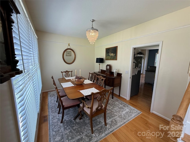 357 Lentz Landing Ln, Nebo, NC 28761 - dining area featuring light wood-type flooring and a chandelier