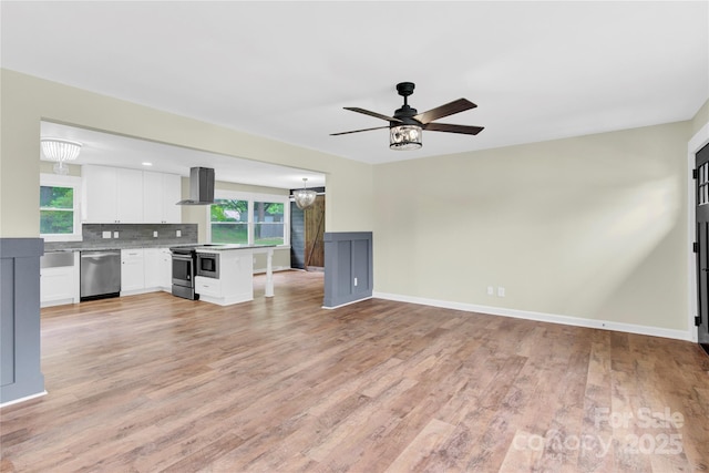 1501 E Church St, Cherryville, NC 28021 - unfurnished living room featuring plenty of natural light, light wood finished floors, and ceiling fan