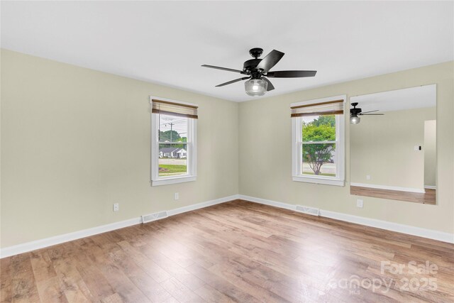 1501 E Church St, Cherryville, NC 28021 - unfurnished room featuring wood finished floors, a ceiling fan, and baseboards