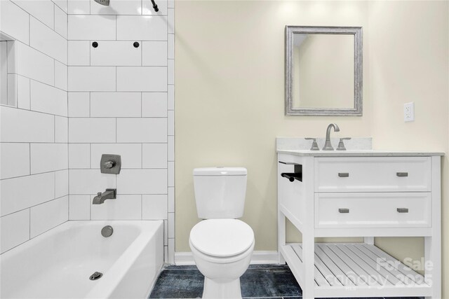 1501 E Church St, Cherryville, NC 28021 - bathroom with toilet, vanity, tub / shower combination, and baseboards