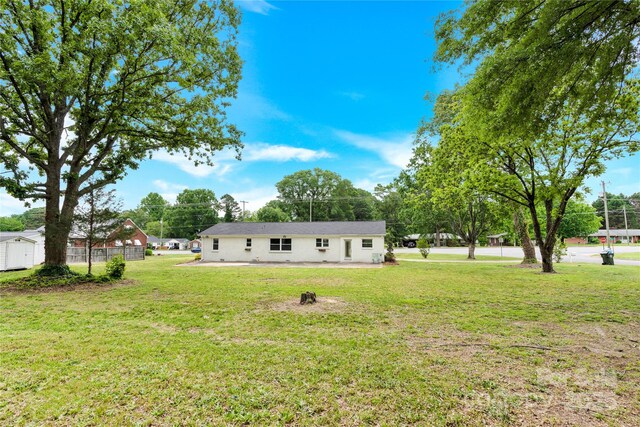 1501 E Church St, Cherryville, NC 28021 - view of green lawn featuring a storage shed and an outdoor structure