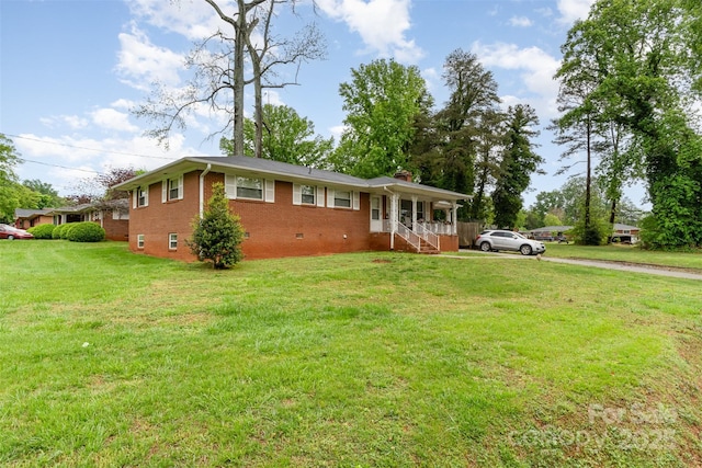 ranch-style house featuring brick siding, a front lawn, a chimney, crawl space, and a porch