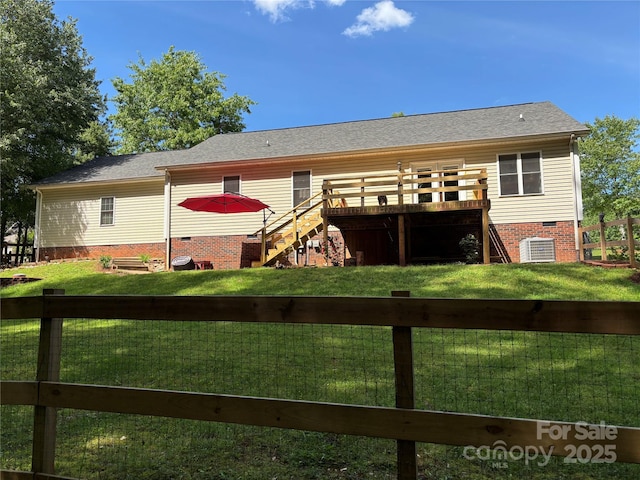 back of property with stairs, a deck, crawl space, and roof with shingles