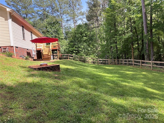 view of yard with stairway and a deck